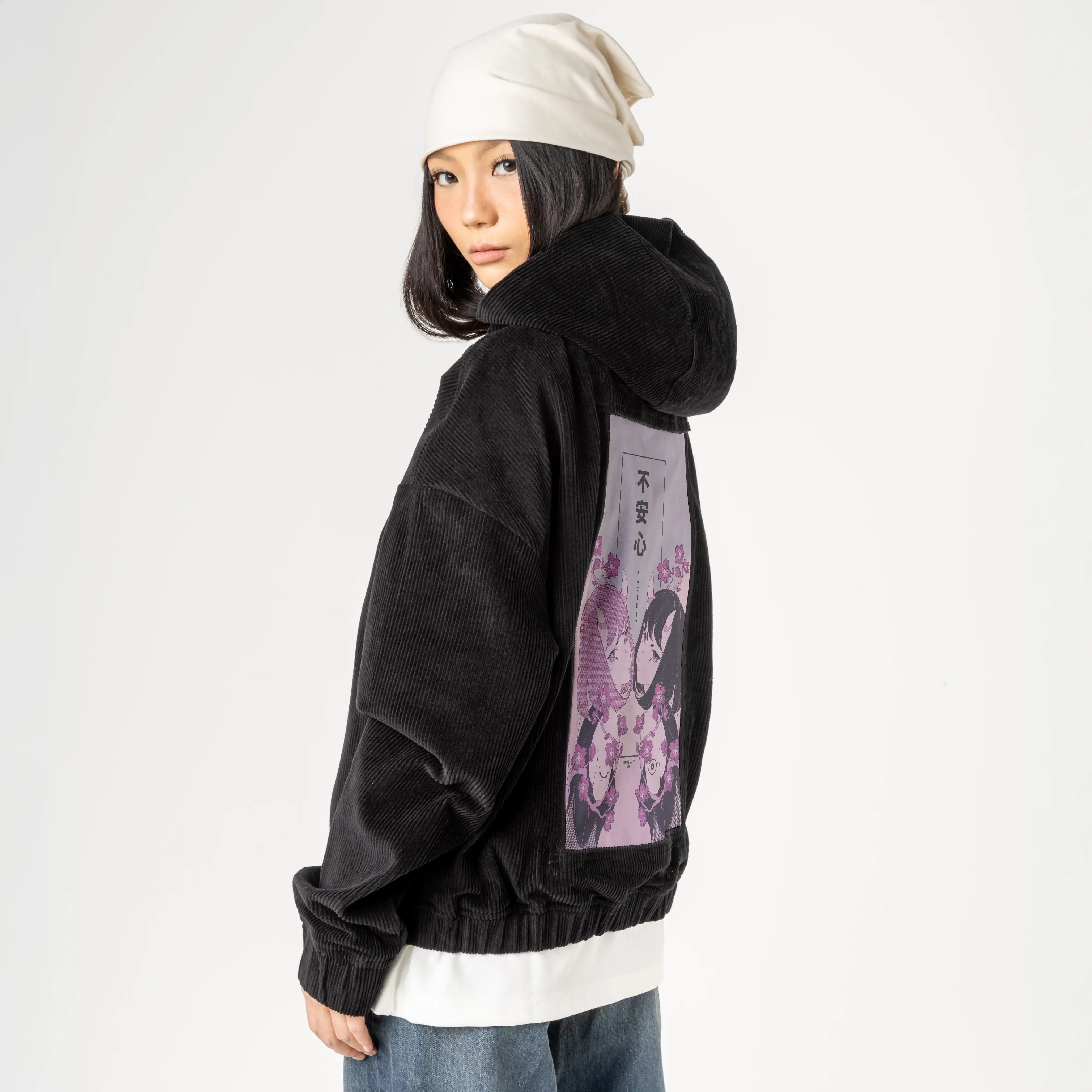 anxiety patch on female retro cord hoodie in onyx