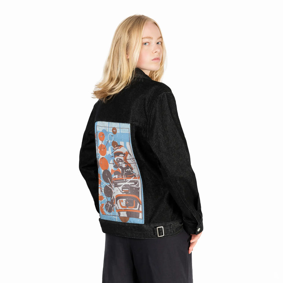 armor patch on female og denim jacket in raven