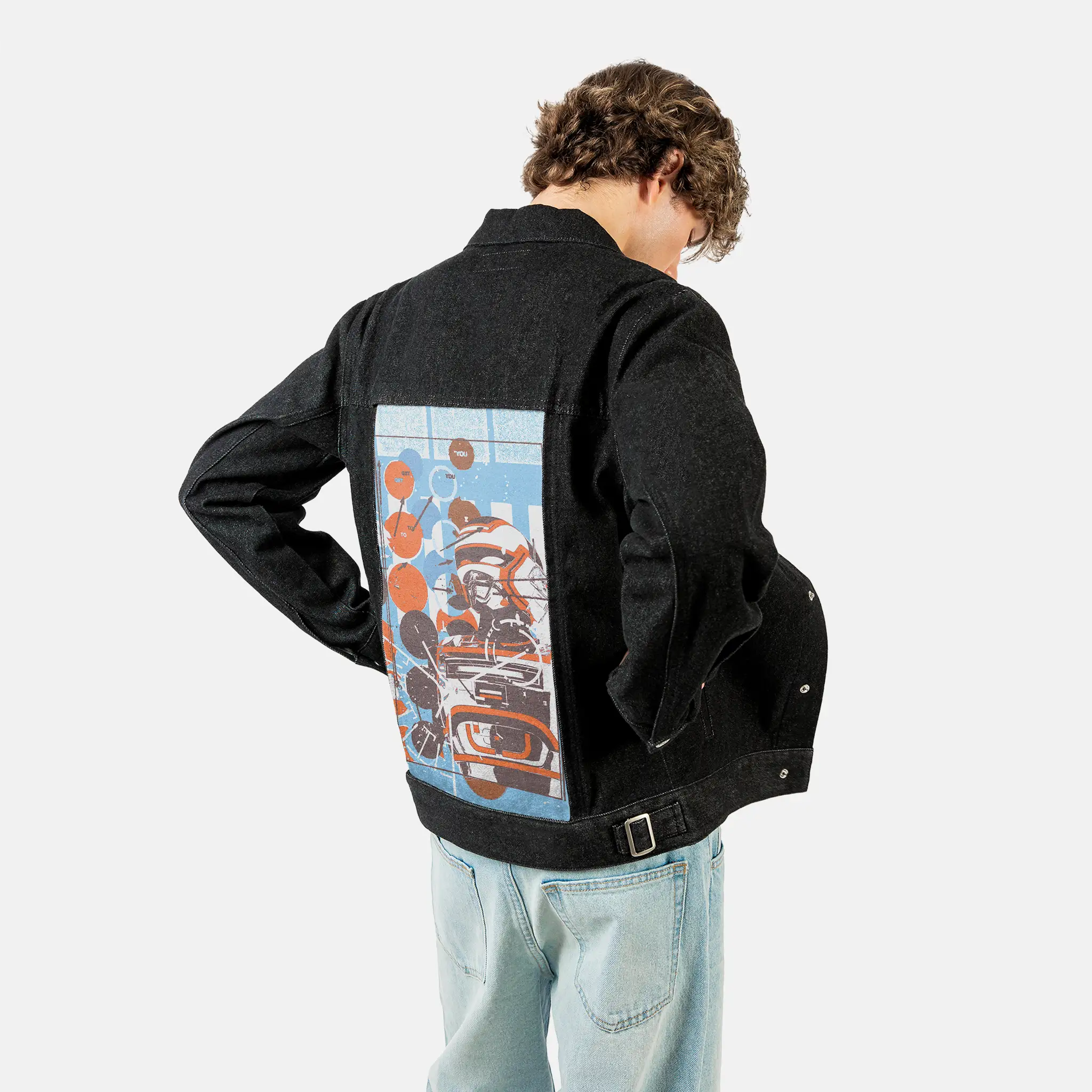 armor patch on male og denim jacket in raven