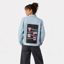 axolotllife patch on female og denim jacket in oceanside