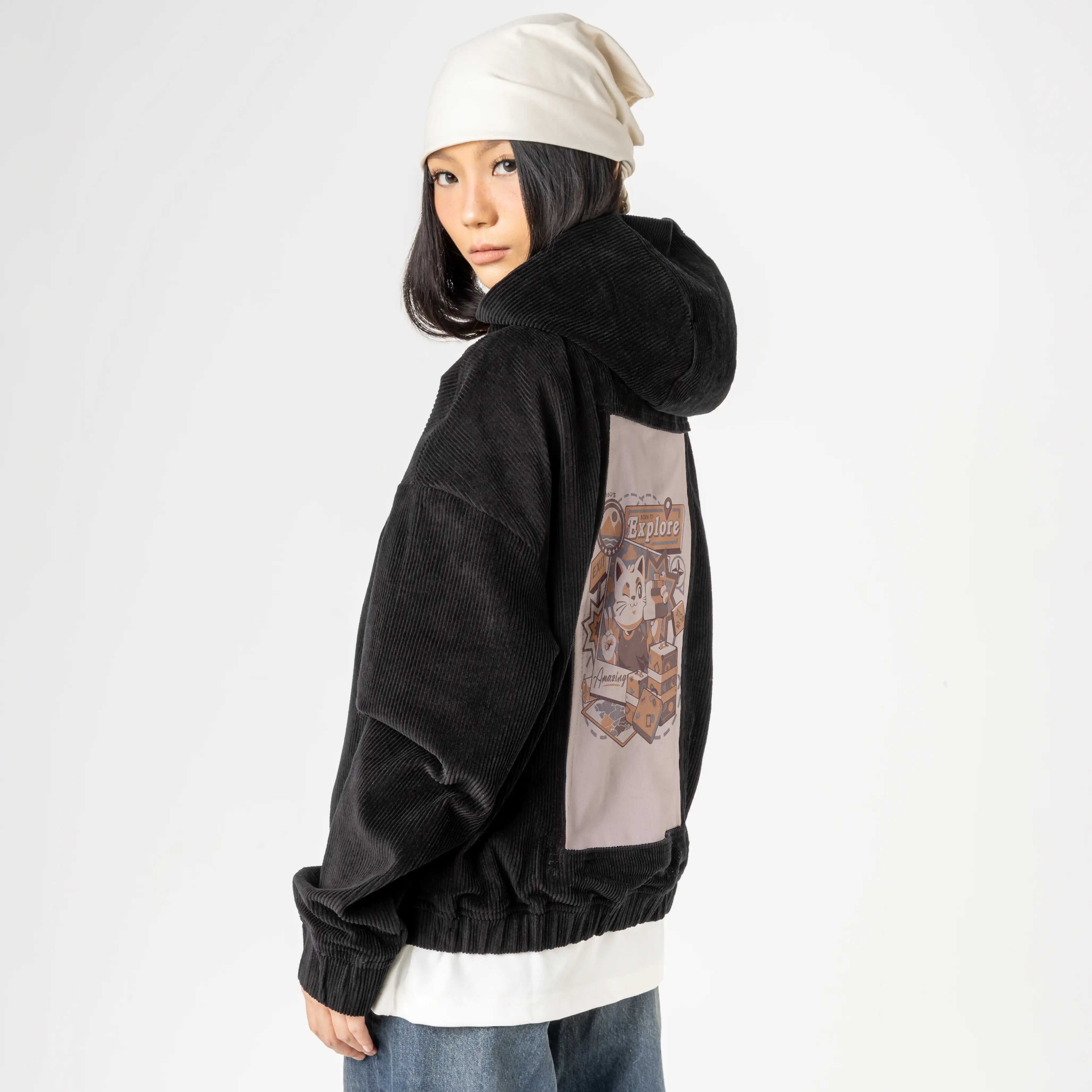 borntoexplore patch on female retro cord hoodie in onyx