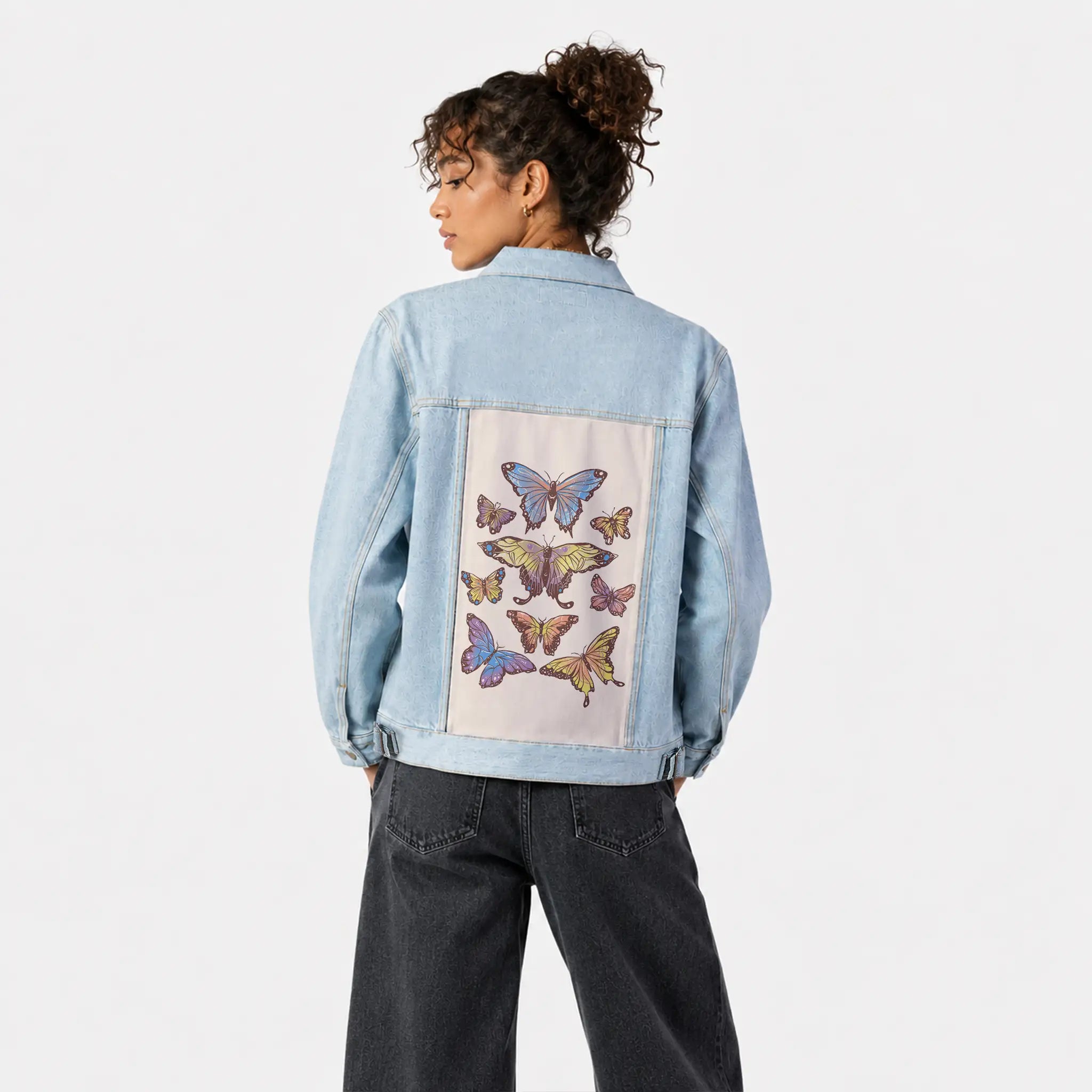 butterflies patch on female og denim jacket in oceanside