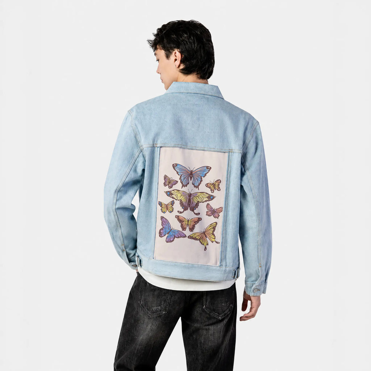 butterflies patch on male og denim jacket in oceanside