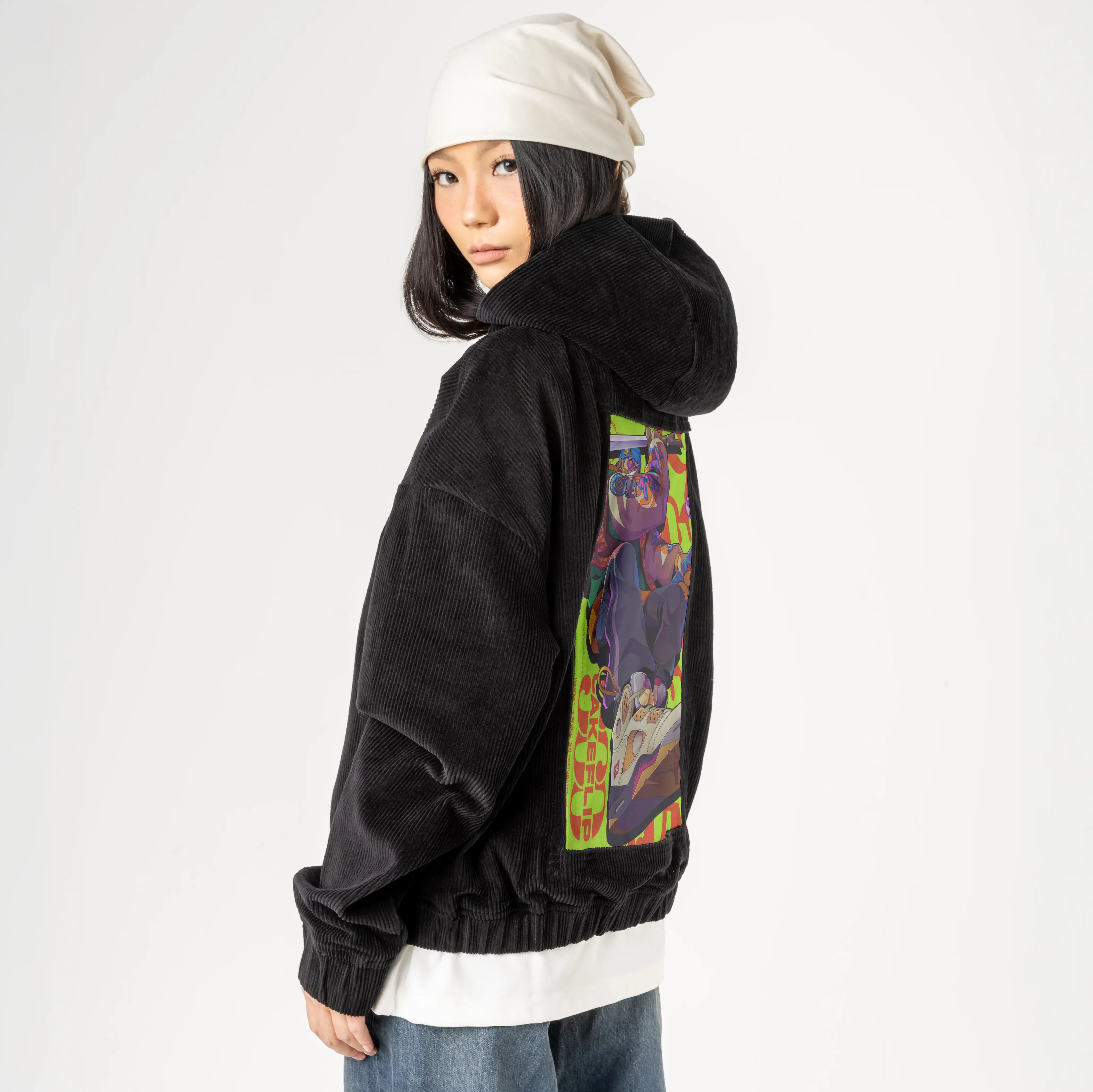 cakeflip patch on female retro cord hoodie in onyx