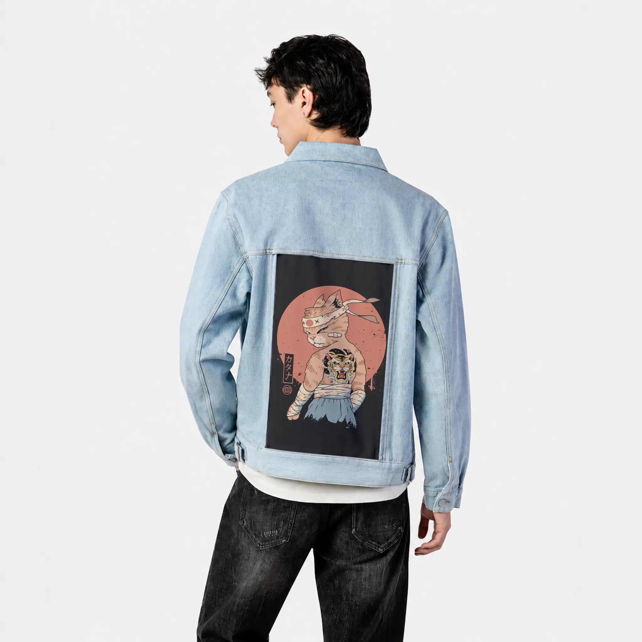 catanadamage patch on male og denim jacket in oceanside
