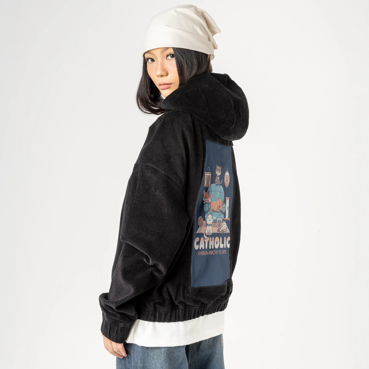 catholic patch on female retro cord hoodie in onyx
