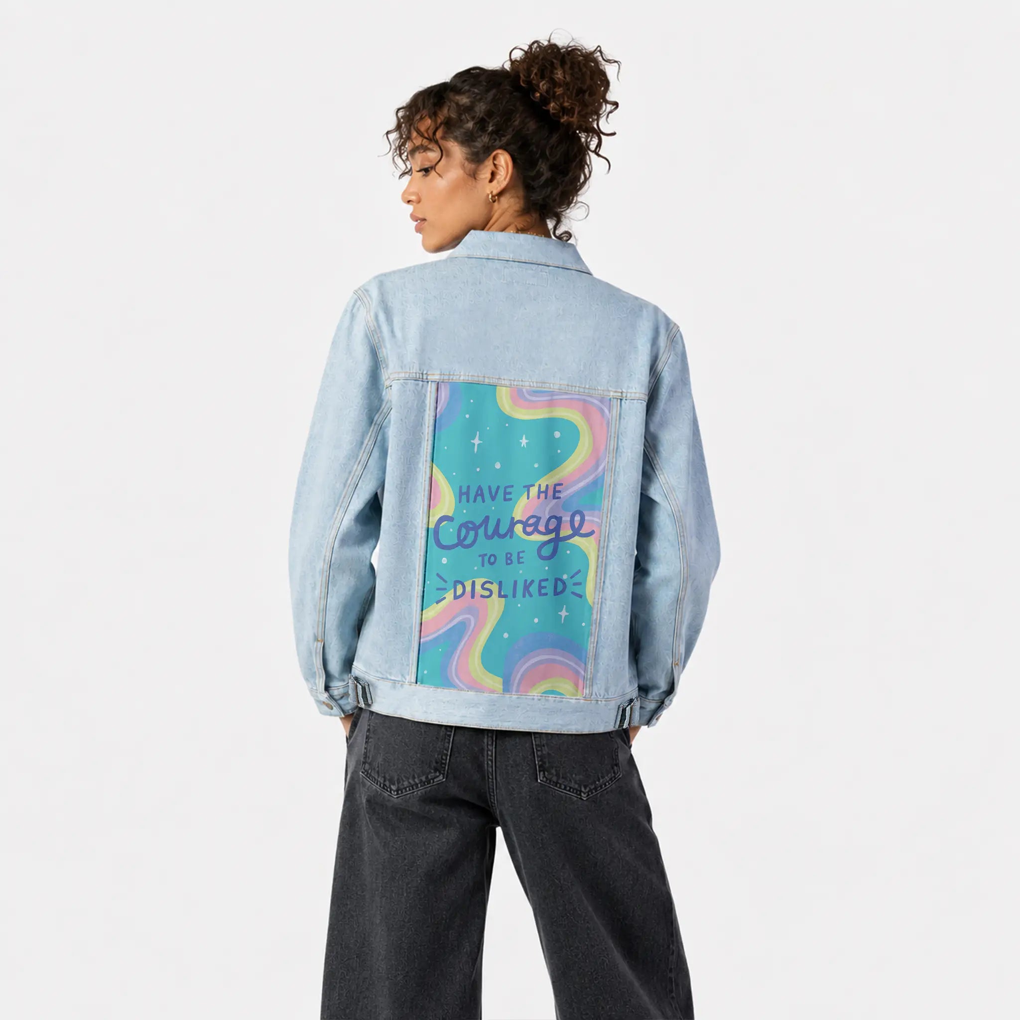 courage patch on female og denim jacket in oceanside