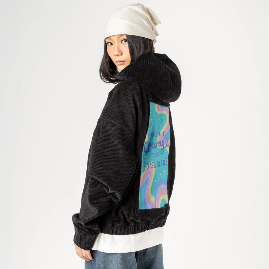 courage patch on female retro cord hoodie in onyx