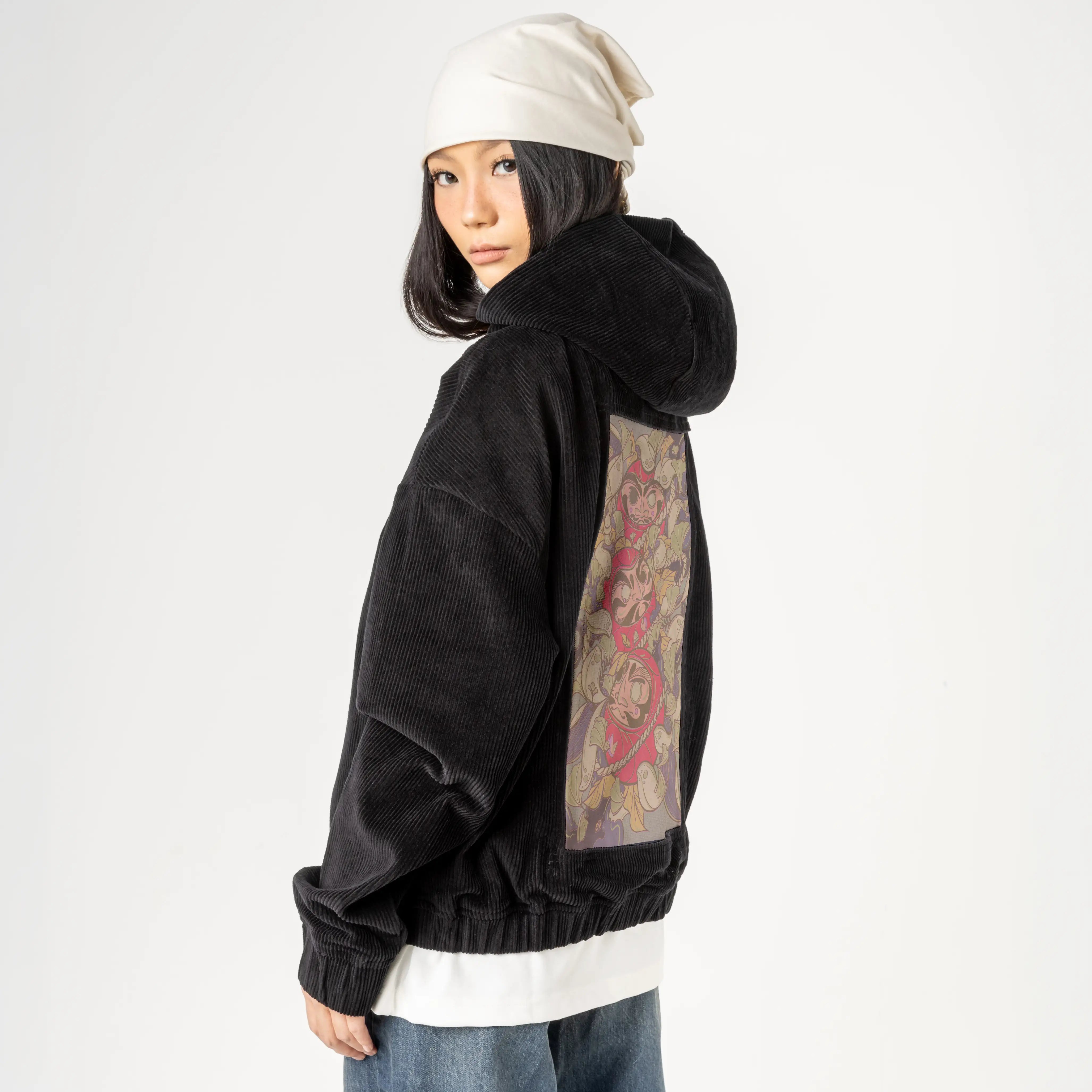 darumatrio patch on female retro cord hoodie in onyx