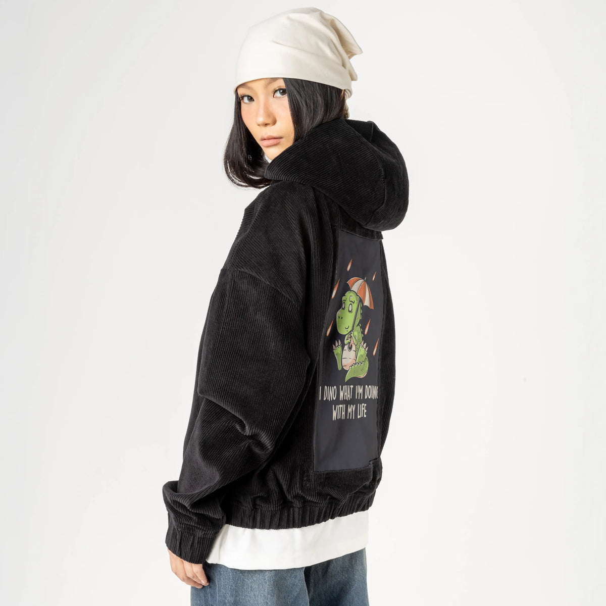 dinolife patch on female retro cord hoodie in onyx