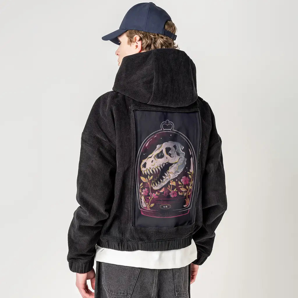 dinorelic patch on male retro cord hoodie in onyx