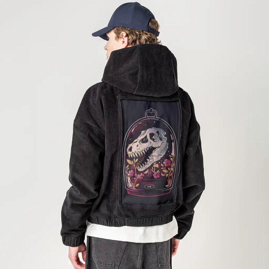 dinorelic patch on male retro cord hoodie in onyx