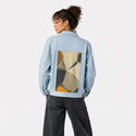 disbursal patch on female og denim jacket in oceanside