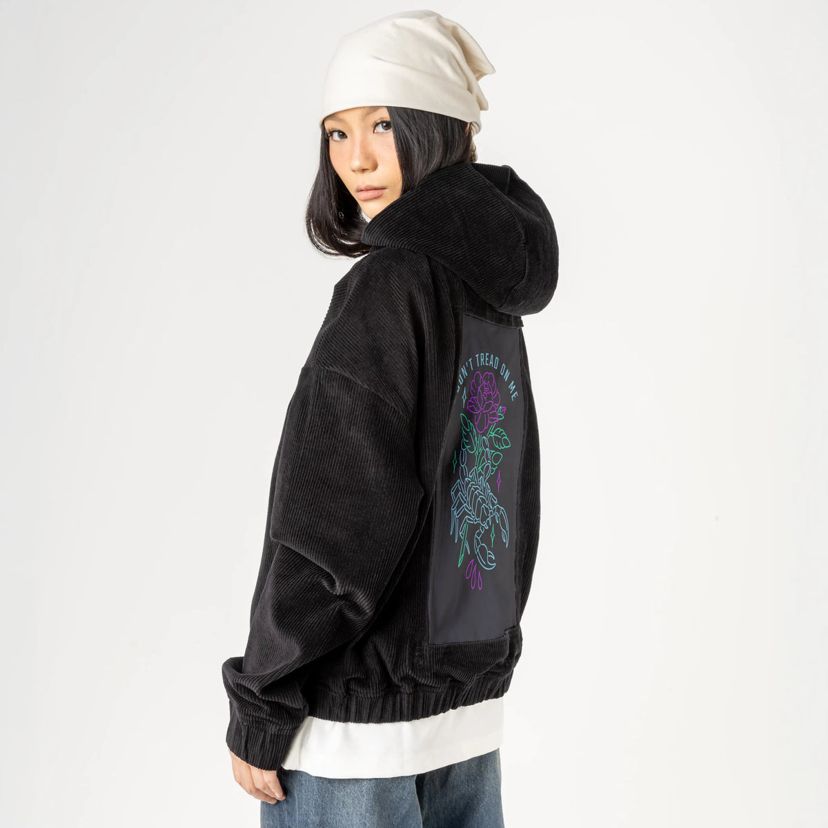 donttreadonme patch on female retro cord hoodie in onyx