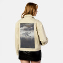 dreamspace patch on female atelier canvas jacket in tan
