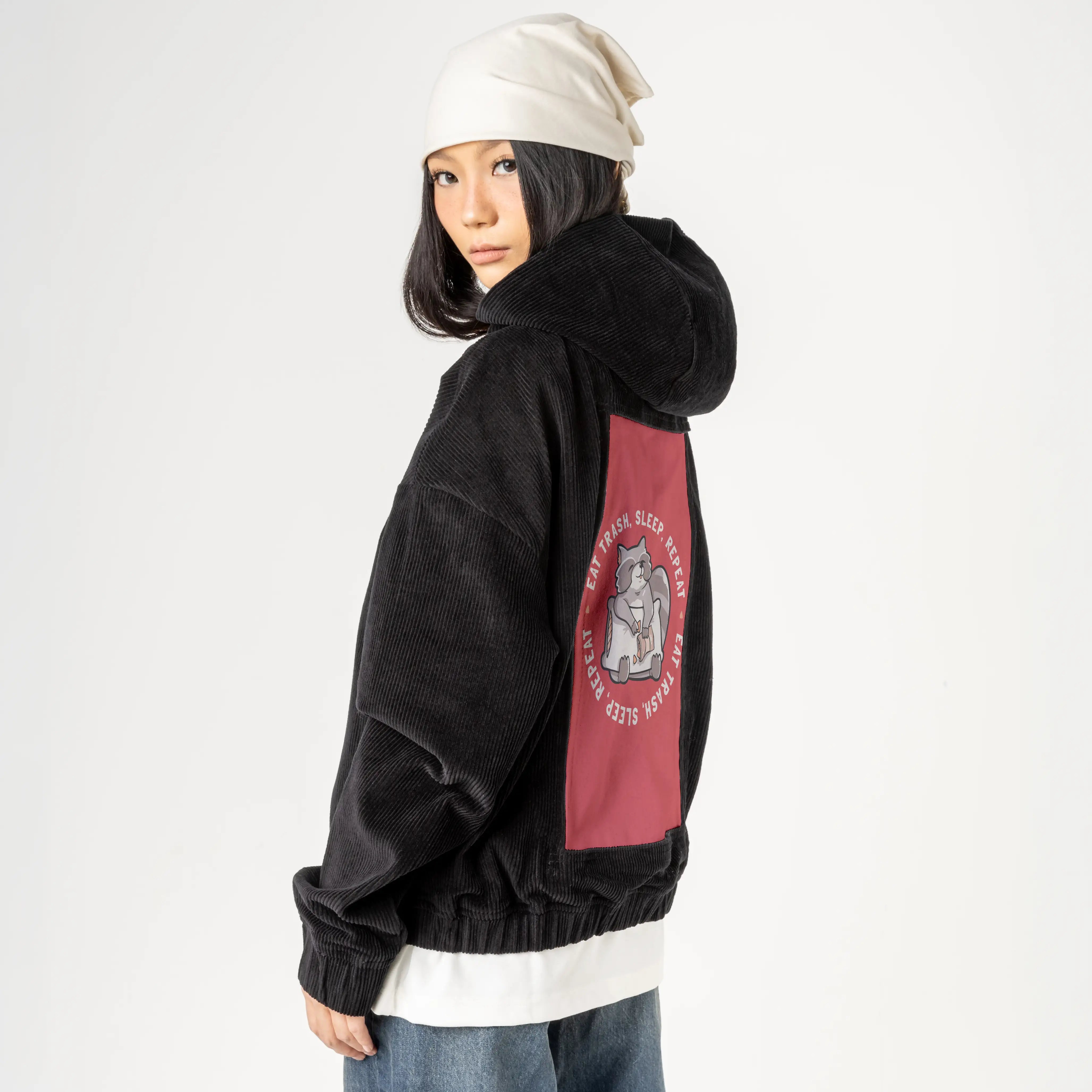 eattrash patch on female retro cord hoodie in onyx