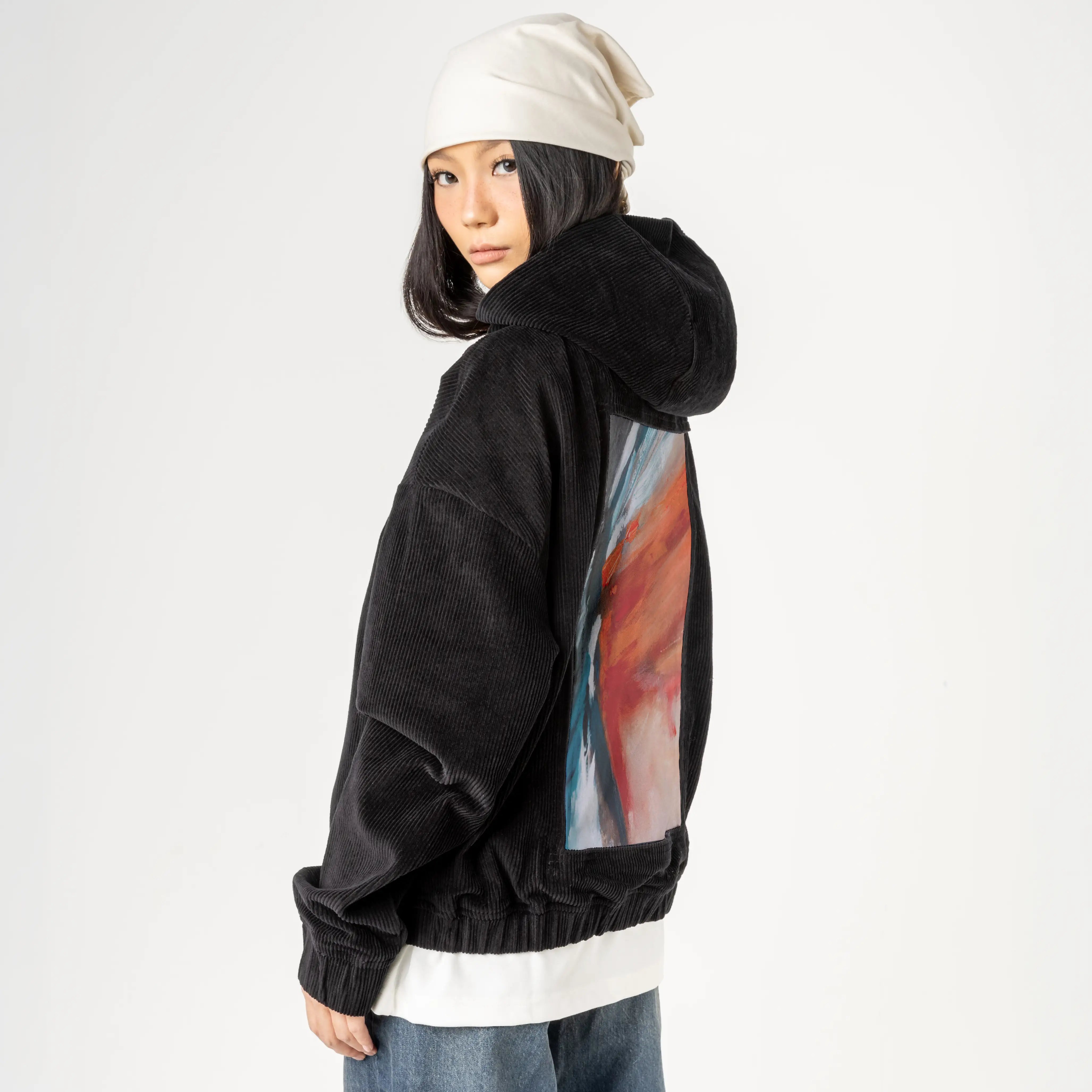 echoofthewild patch on female retro cord hoodie in onyx