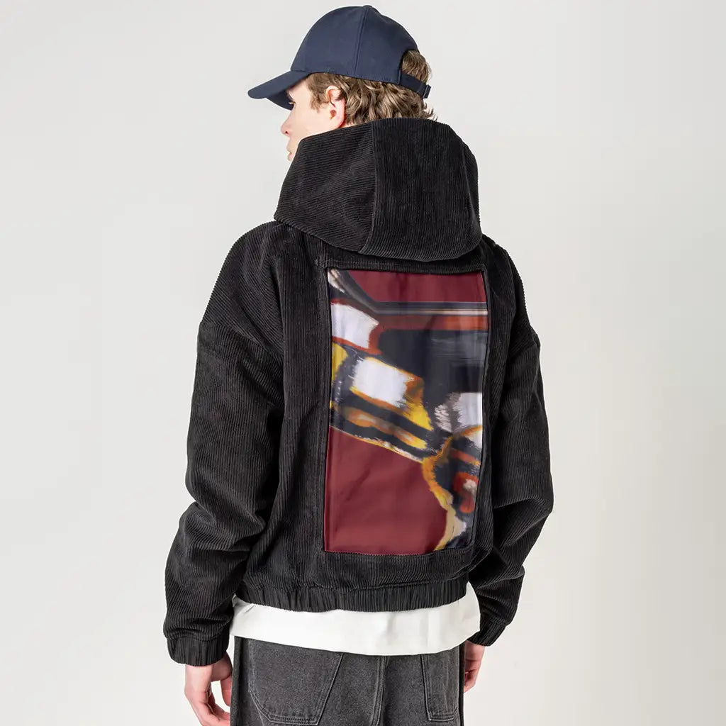 emberinmotion patch on male retro cord hoodie in onyx