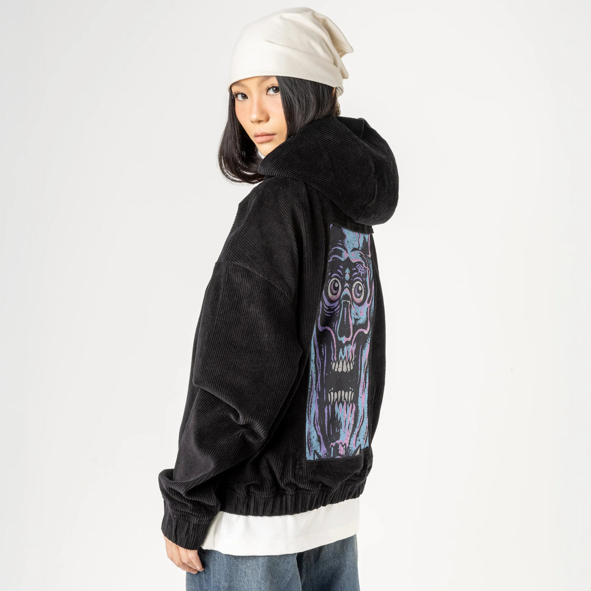 facemelter patch on female retro cord hoodie in onyx