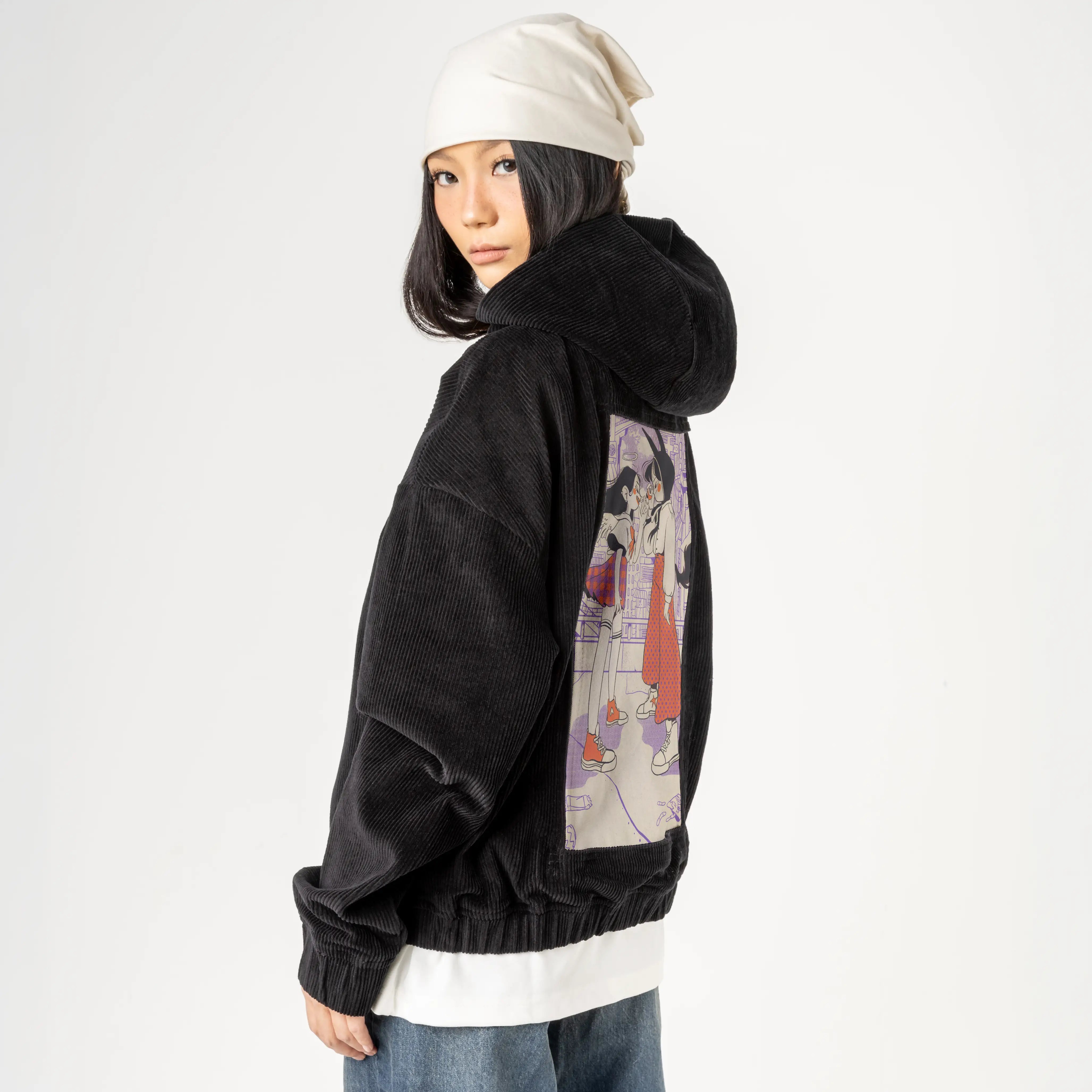 faceoff patch on female retro cord hoodie in onyx