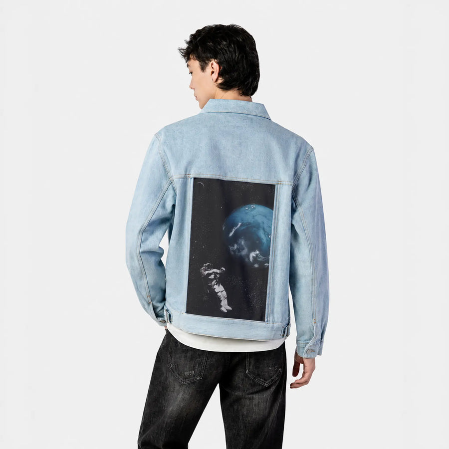floatingastronaut patch on male og denim jacket in oceanside