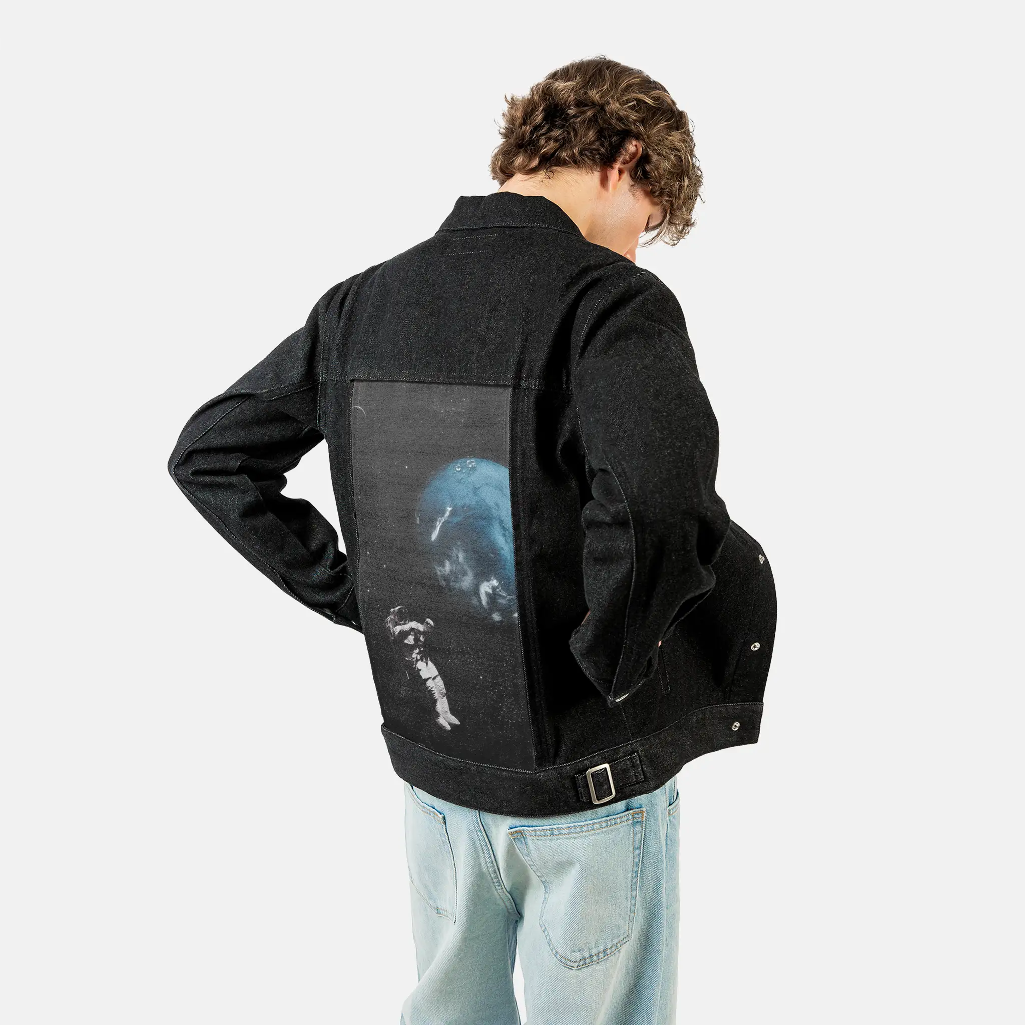 floatingastronaut patch on male og denim jacket in raven
