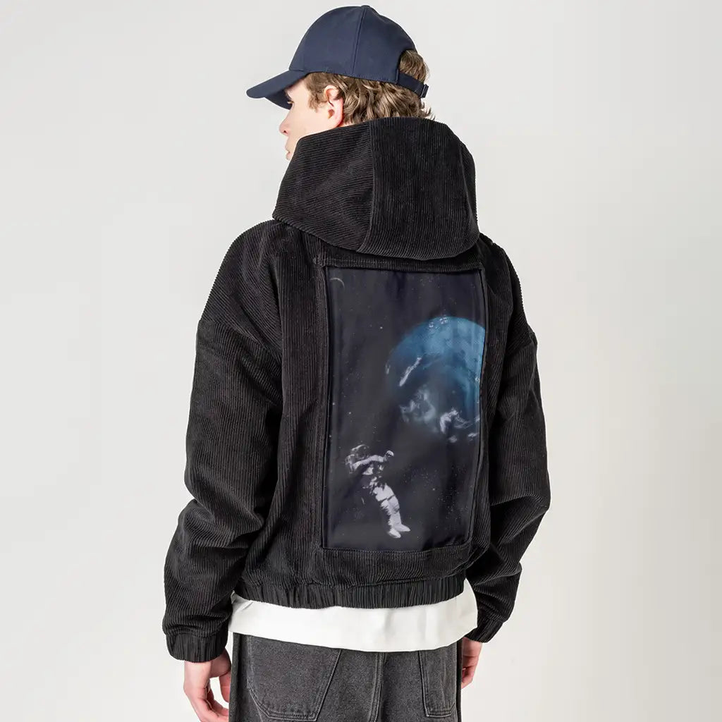 floatingastronaut patch on male retro cord hoodie in onyx