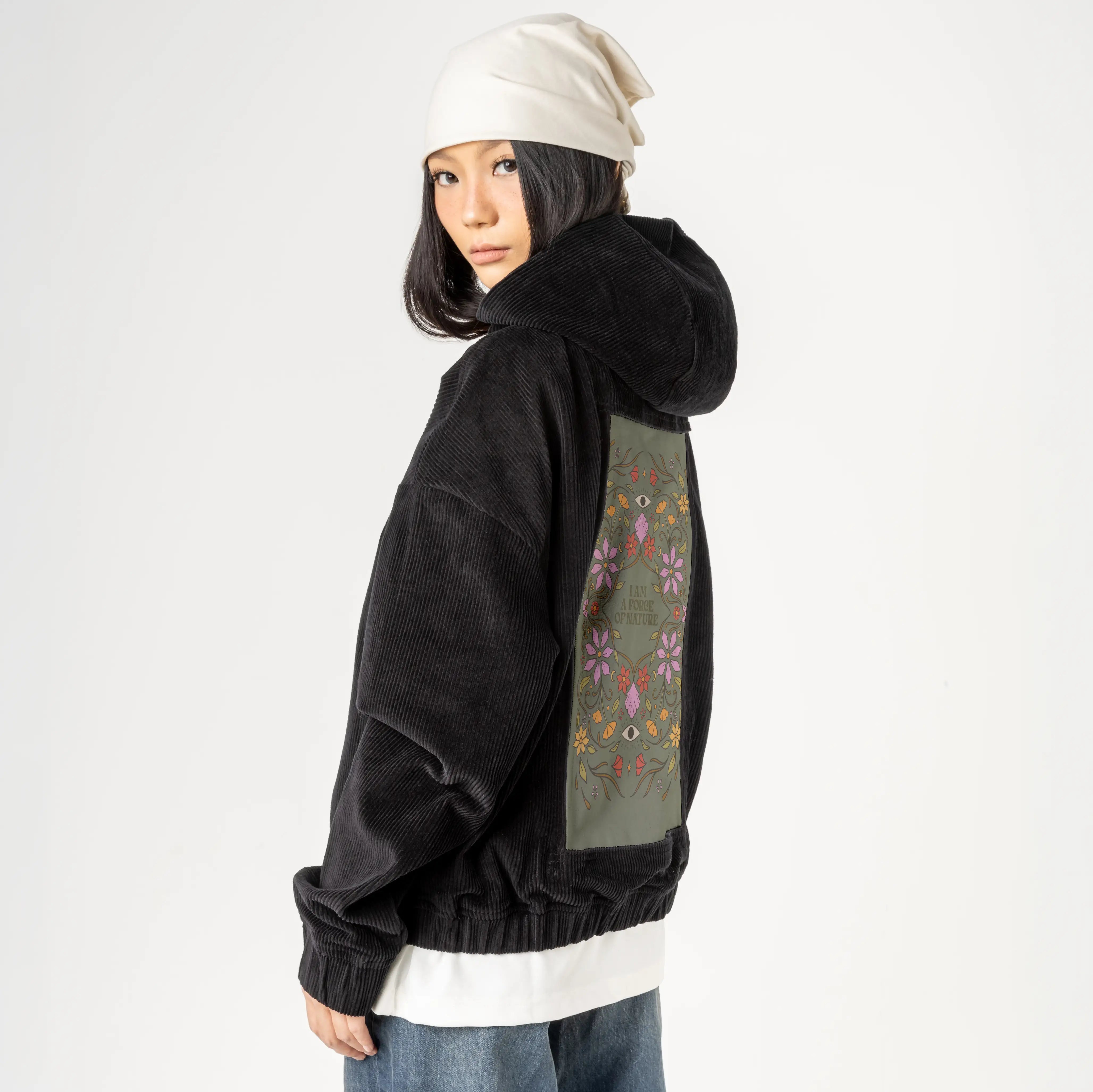 forceofnature patch on female retro cord hoodie in onyx