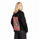 givingupchristmas patch on female og denim jacket in raven