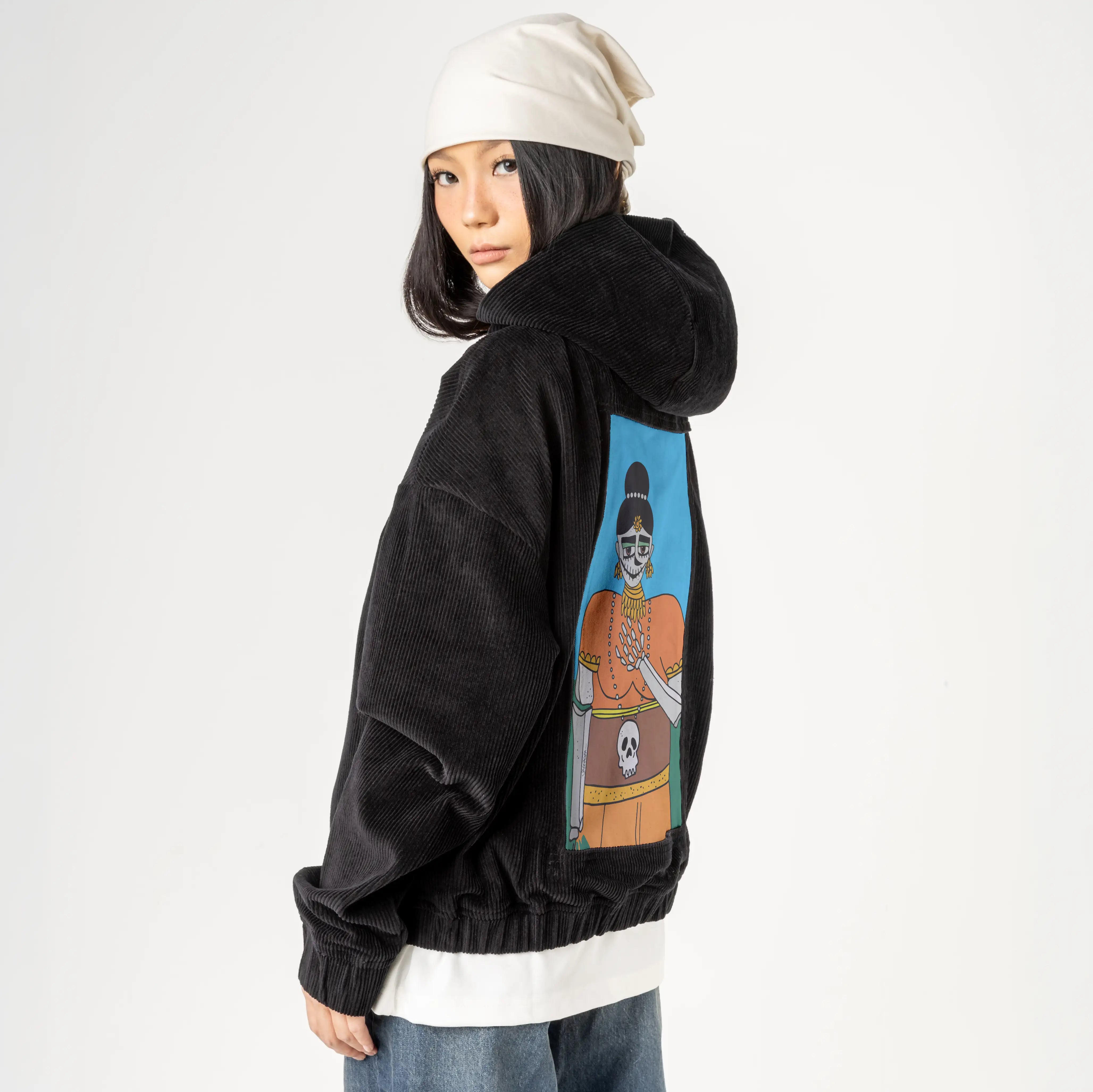 halloween patch on female retro cord hoodie in onyx
