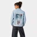 handscapecaress patch on female og denim jacket in oceanside