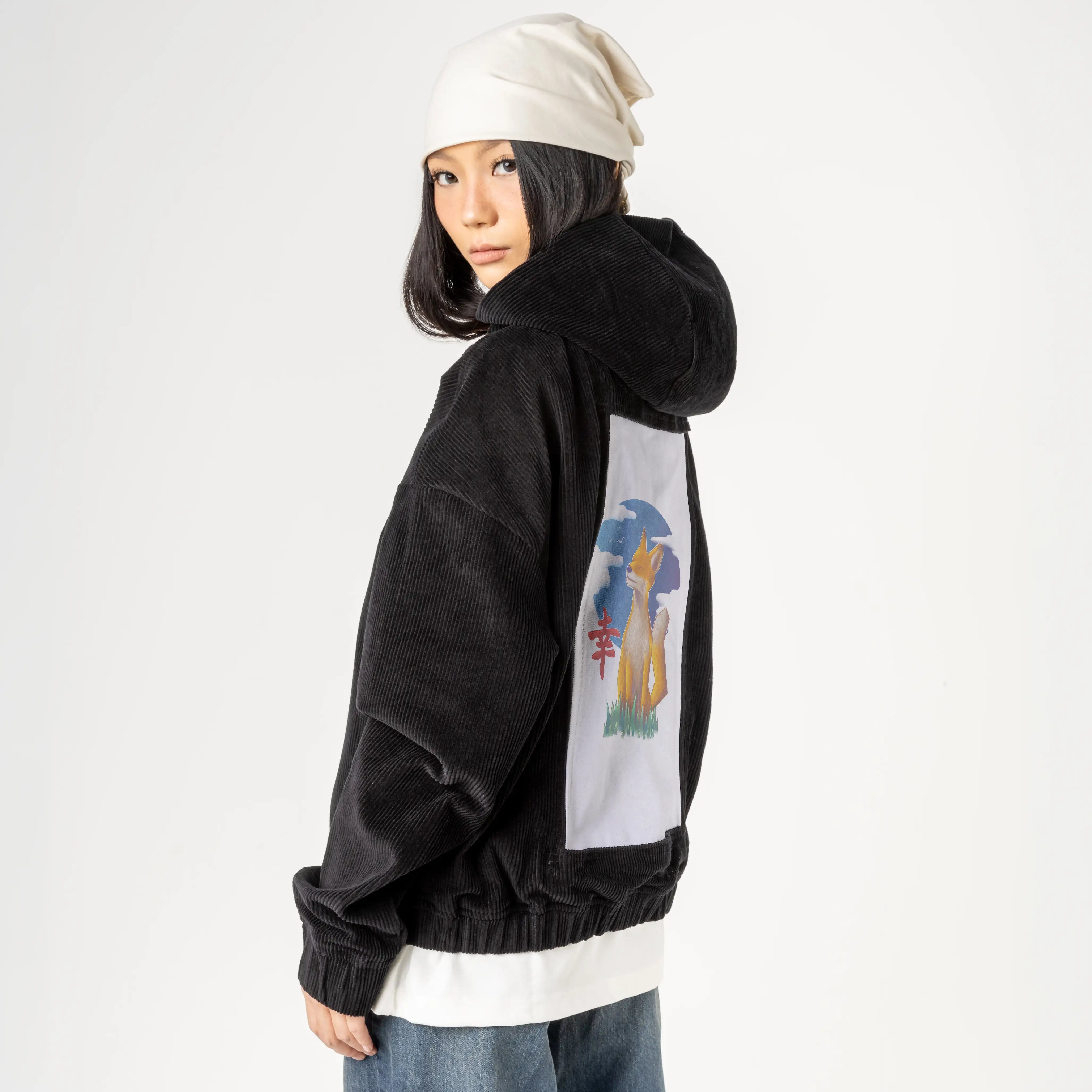 happiness patch on female retro cord hoodie in onyx