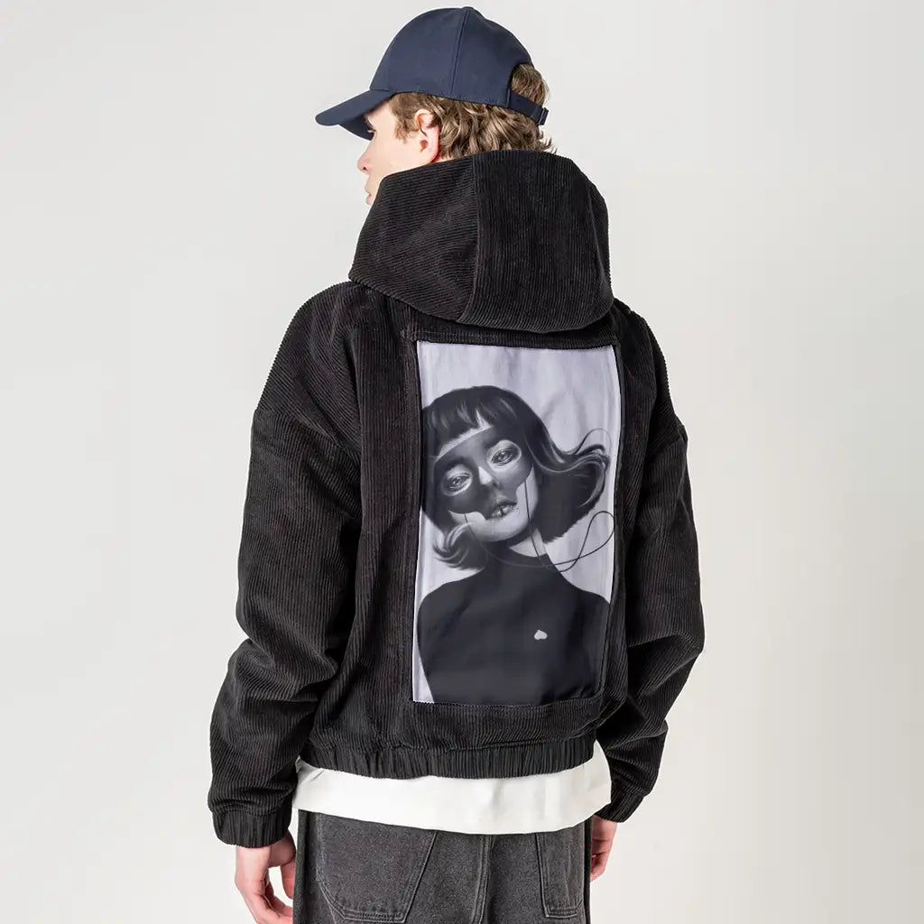 haunting patch on male retro cord hoodie in onyx