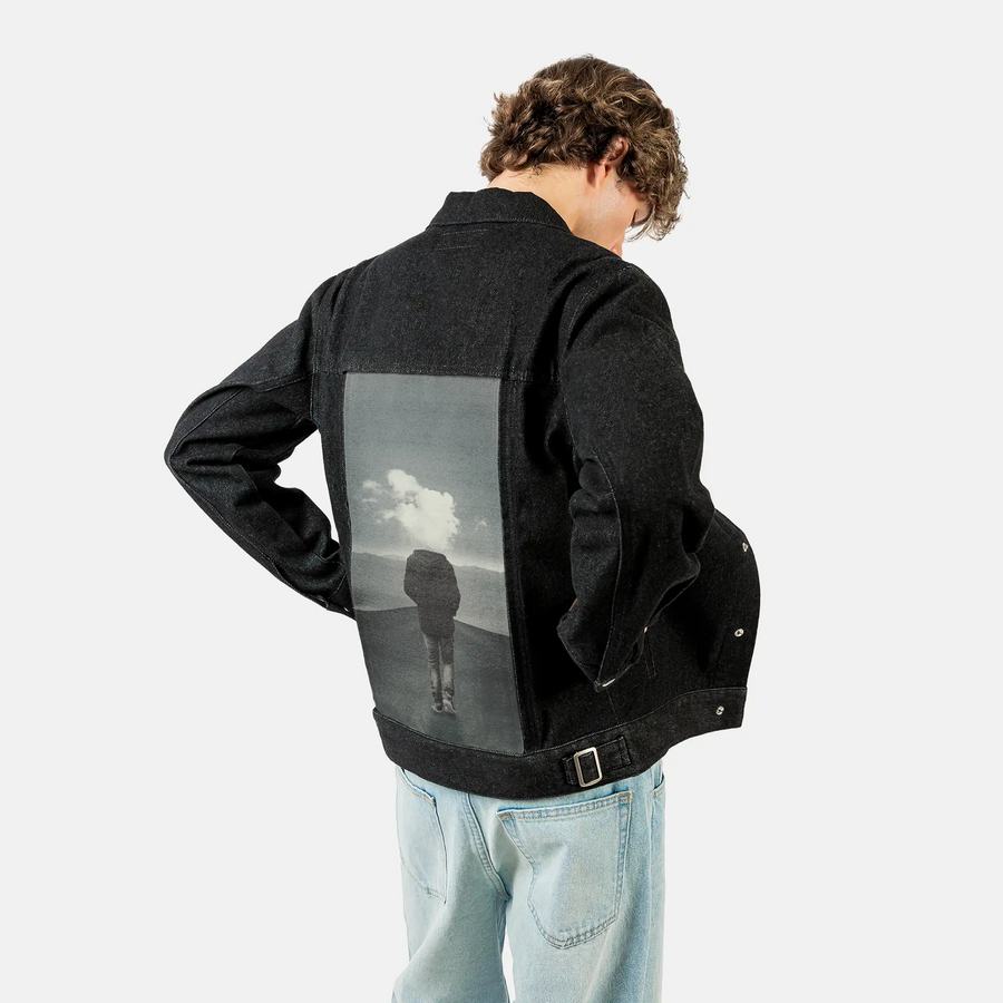 headincloud patch on male og denim jacket in raven