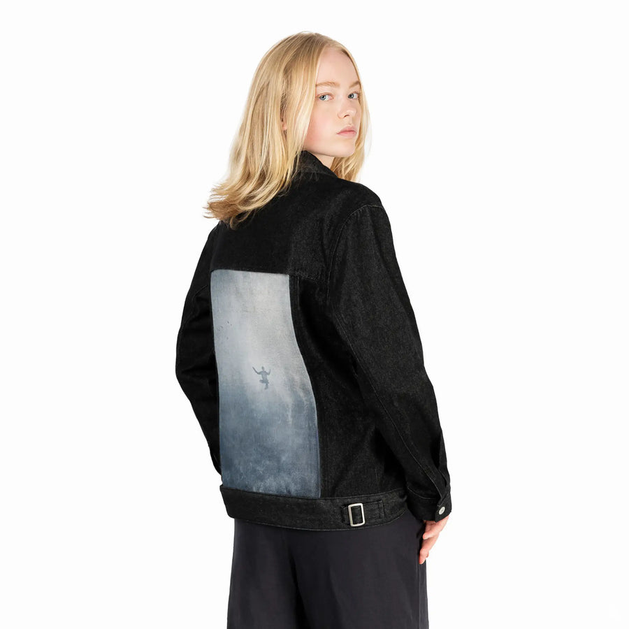 innerpeace patch on female og denim jacket in raven