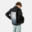 innerpeace patch on male og denim jacket in raven