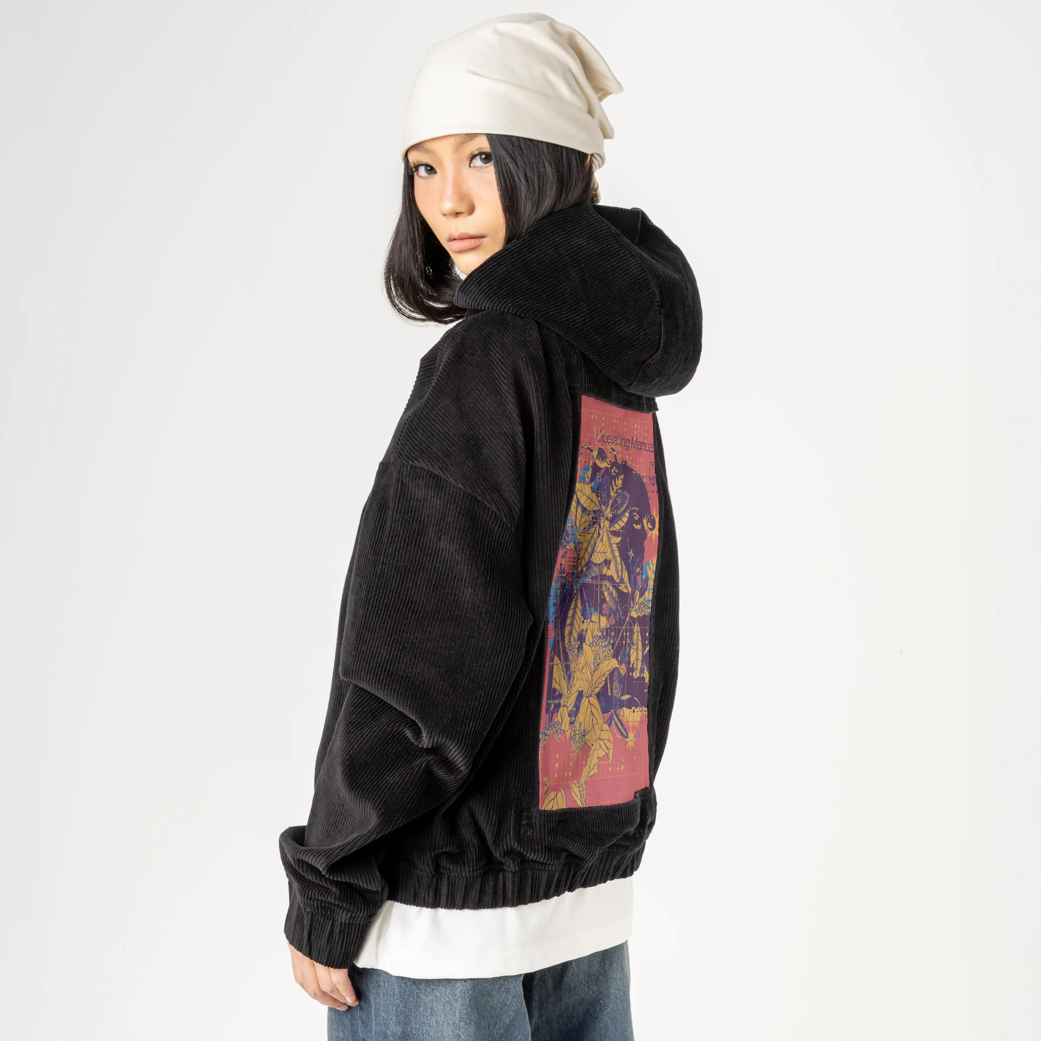 livingstructures patch on female retro cord hoodie in onyx