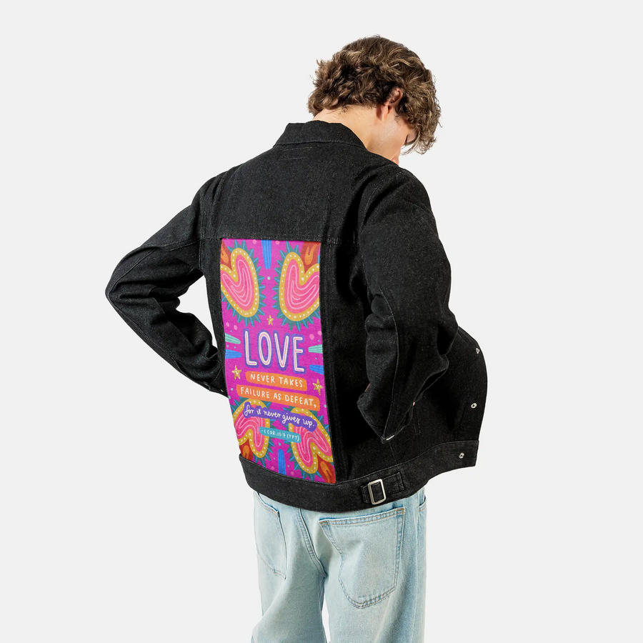 lovenevergivesup patch on male og denim jacket in raven
