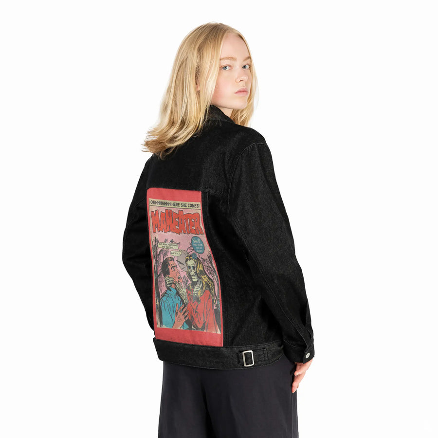 maneater patch on female og denim jacket in raven