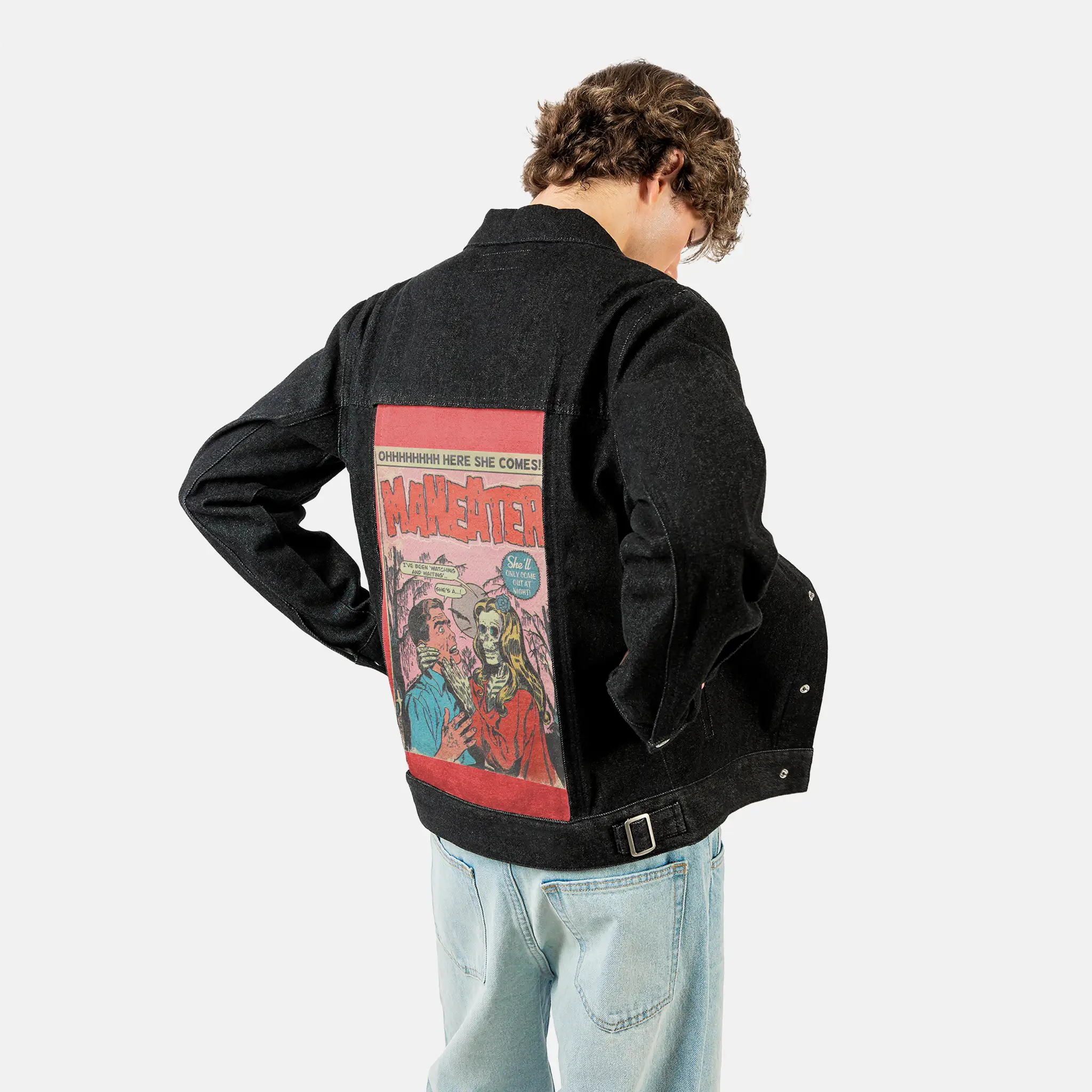 maneater patch on male og denim jacket in raven