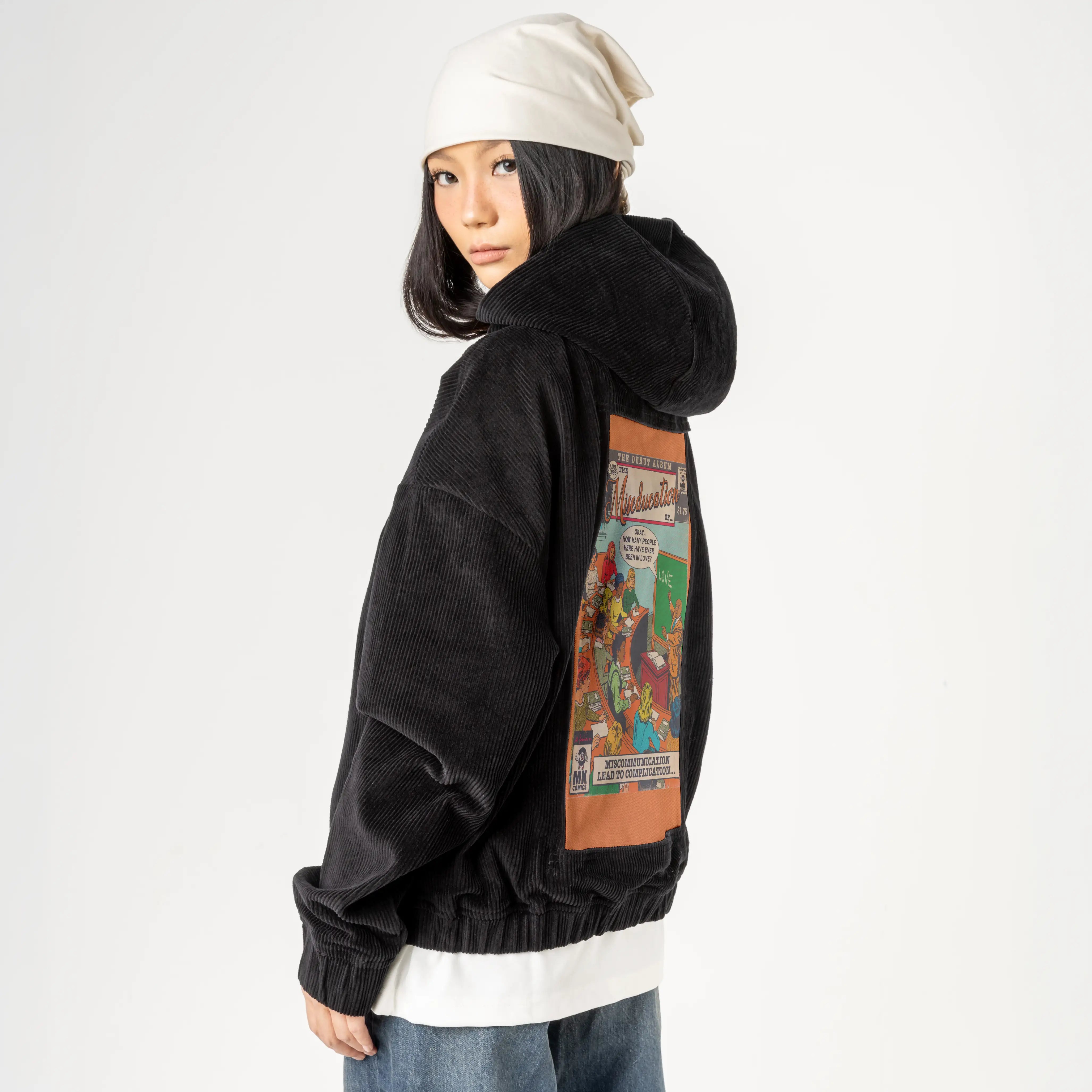 miseducation patch on female retro cord hoodie in onyx