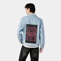 moth patch on male og denim jacket in oceanside
