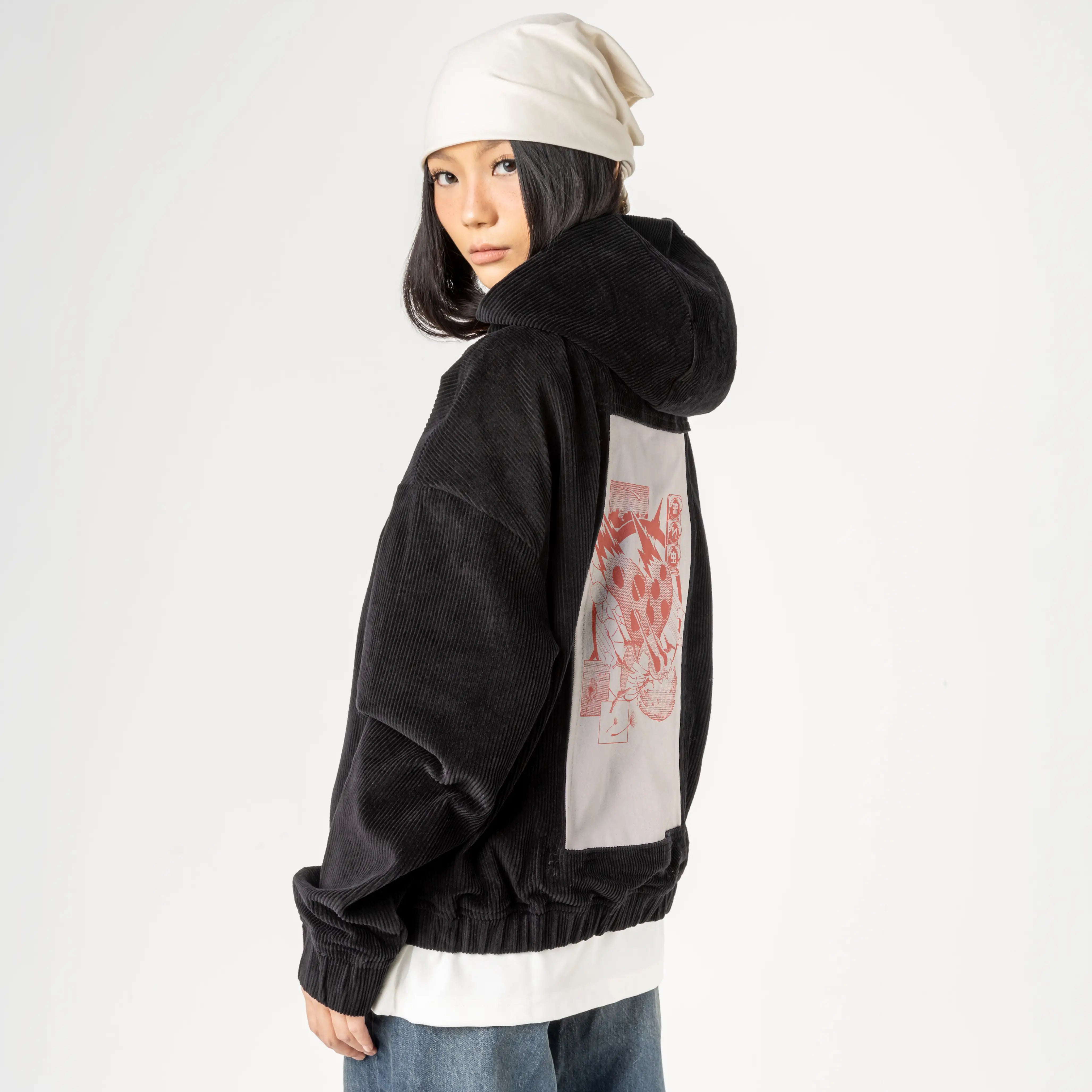 nagaremushi patch on female retro cord hoodie in onyx