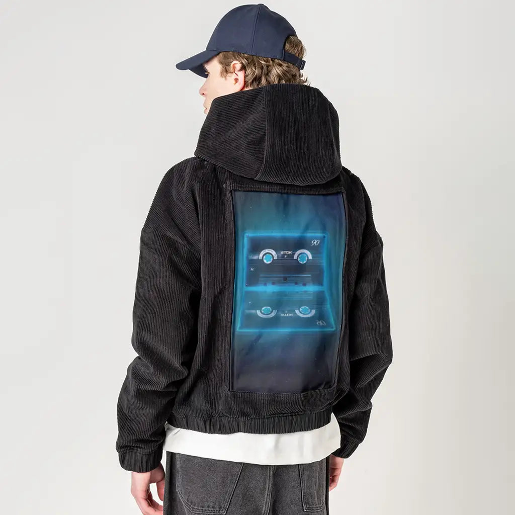 neoncassette patch on male retro cord hoodie in onyx