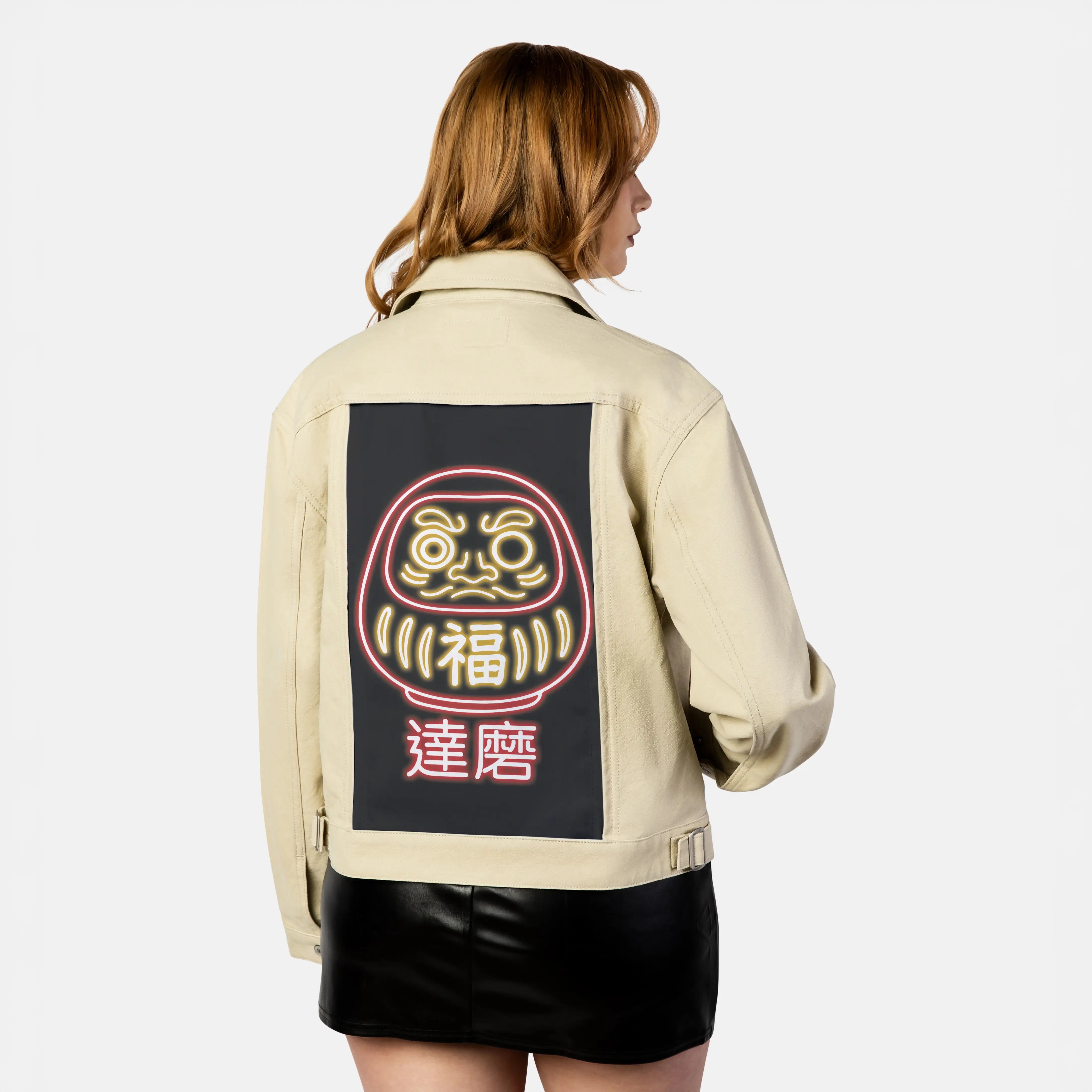 neondaruma patch on female atelier canvas jacket in tan