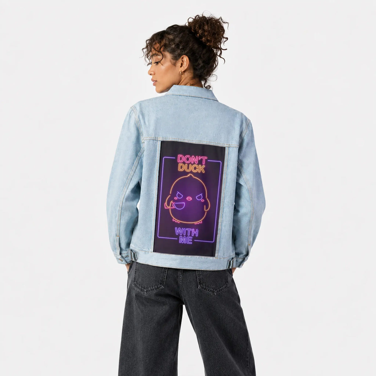 neondontduckwithme patch on female og denim jacket in oceanside