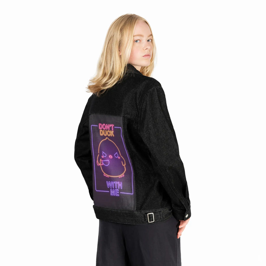 neondontduckwithme patch on female og denim jacket in raven