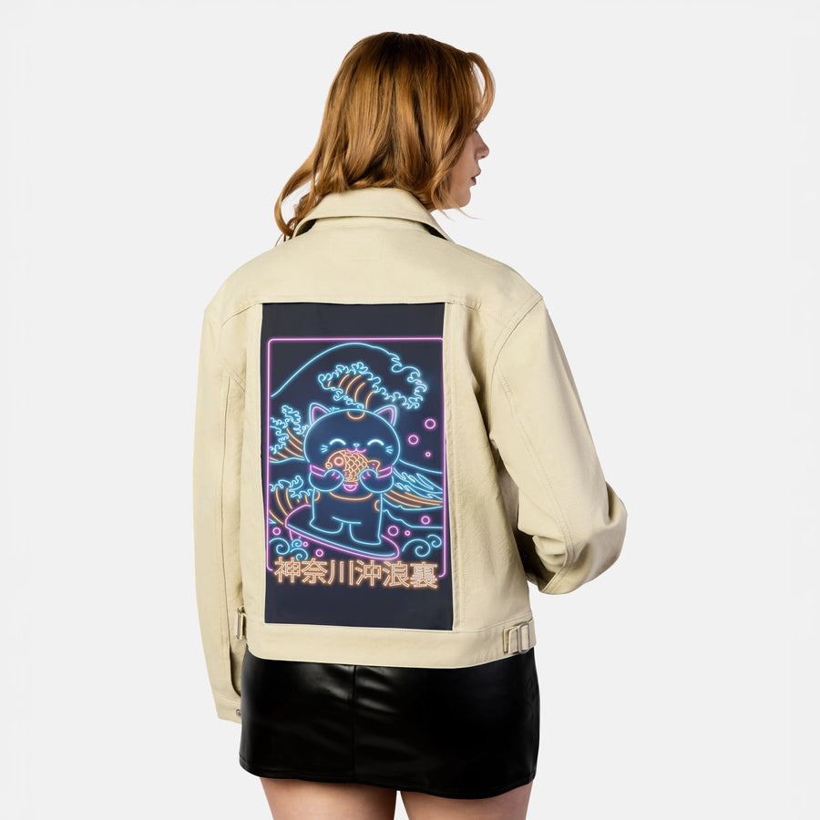 neonretronekosurfing patch on female atelier canvas jacket in tan