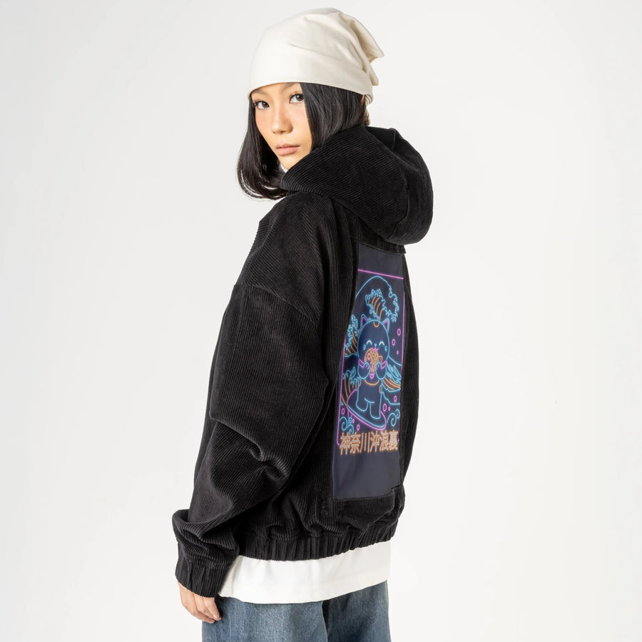 neonretronekosurfing patch on female retro cord hoodie in onyx