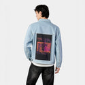 neversleeps patch on male og denim jacket in oceanside